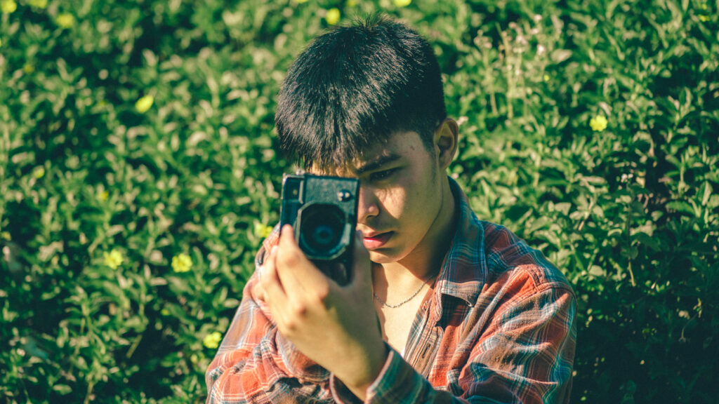 John Baren Cruz holding camera