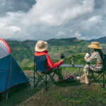 Couple tourists enjoying in the camping on mountains